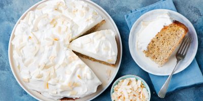 Three milk cake, tres leches cake with coconut. Traditional dessert of Latin America Top view
